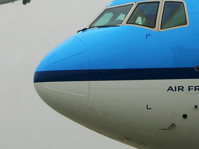 A KLM Royal Dutch Airlines Boeing 777 is parked at Chengdu airport as an Air China plane takes off behind, during a ceremony for the beginning of Chengdu to Amsterdam direct flights, in Chengdu in China's southwest Sichuan province Monday, May 29, 2006. KLM Royal Dutch Airlines began flights today between Chengdu and Amsterdam, which involves cooperation by KLM Royal Dutch Airlines and China Southern Airlines. (AP Photo/Color China Photo) ** CHINA OUT **