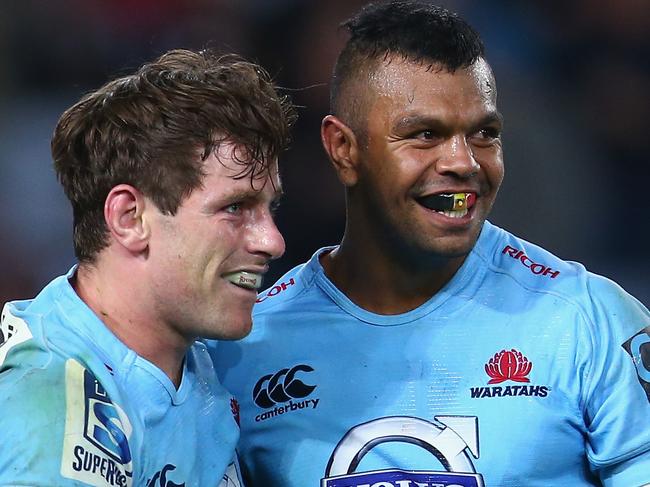 SYDNEY, AUSTRALIA - MAY 23: Bernard Foley (L) of the Waratahs celebrates with his team mate Kurtley Beale of the Waratahs after scoring a try during the round 15 Super Rugby match between the Waratahs and the Crusaders at ANZ Stadium on May 23, 2015 in Sydney, Australia. (Photo by Mark Kolbe/Getty Images)