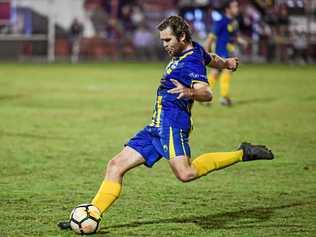 MOTION: The Waves' Matt Twyford kicks the ball forward against Brothers Aston Villa on Saturday in the Wide Bay Premier League. Picture: Brian Cassidy