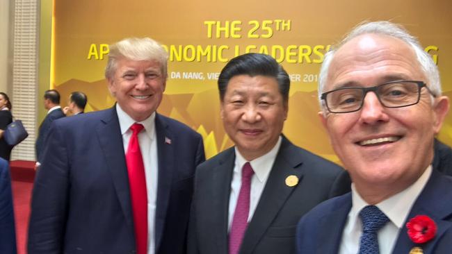 Malcolm Turnbull takes a selfie with US President Donald Trump and President Xi at APEC.