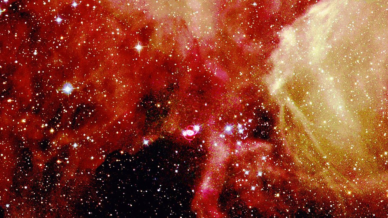 MAN  Glittering stars and wisps of gas create a breathtaking backdrop for the self-destruction of a massive star, called supernova 1987A, in the Large Magellanic Cloud, a nearby galaxy. Astronomers in the Southern hemisphere witnessed the brilliant explosion of this star on Feb. 23, 1987. Picture: SUPPLIED
