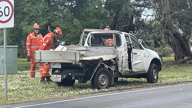 SES crew inspecting the vehicle that rolled over. Picture: Jack Colantuono