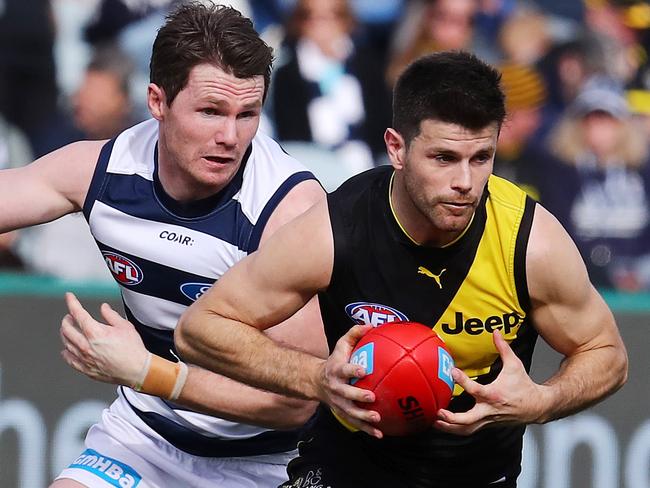 AFL Round 21. Geelong v Richmond at Simonds Stadium. Richmond's Trent Cotchin tailed by Geelong's Patrick Dangerfield   . Pic: Michael Klein