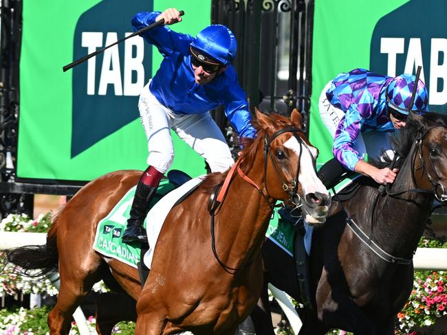 MELBOURNE, AUSTRALIA - MARCH 30: Ben Melham riding Cascadian defeats Declan Bates riding Pride of Jenni in Race 8, the Tab Australian Cup, during Melbourne Racing at Flemington Racecourse on March 30, 2024 in Melbourne, Australia. (Photo by Vince Caligiuri/Getty Images)