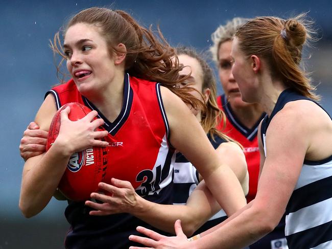 GEELONG, AUSTRALIA - JUNE 16:  Eloise Gardner of the Falcons runs with the ball while being tackled during the round six VFLW match between Geelong and Darebin at GMHBA Stadium on June 16, 2018 in Geelong, Australia.  (Photo by Kelly Defina/AFL Media/Getty Images)