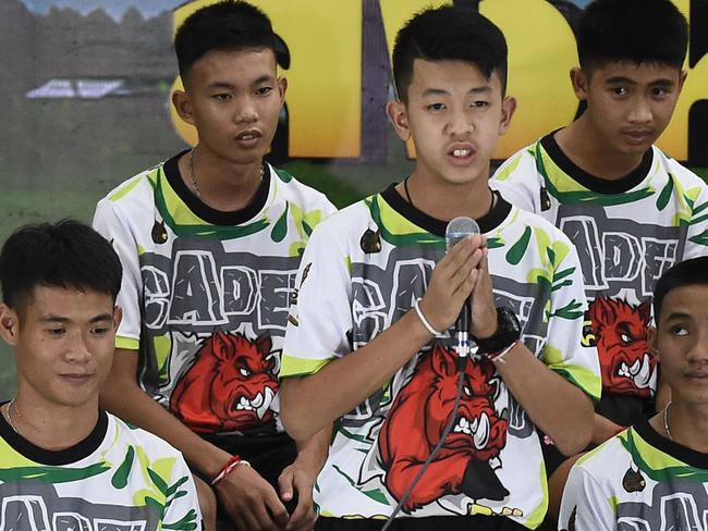 Pornchai Khamluang (C), one of the 12 boys dramatically rescued from deep inside a Thai cave, speaks during the media conference.