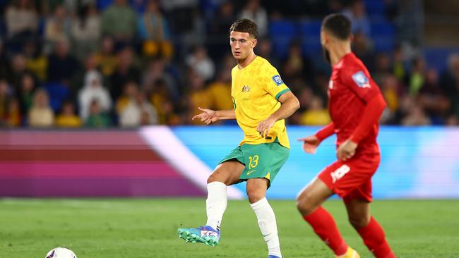 Alessandro Circati (left) passes the ball during the Socceroos’ 1-0 loss to Bahrain. Picture: Chris Hyde/Getty Images