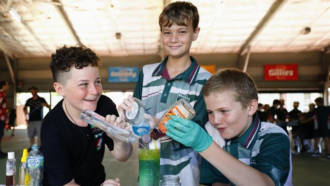 Whitfield State School has hosted its annual science day, learning practical applications for science and experiments. Grade 6 students Theo Candy, Koby Thornton and Christian Philp have some fun learning about the different viscosity and density of household liquids. Picture: Brendan Radke