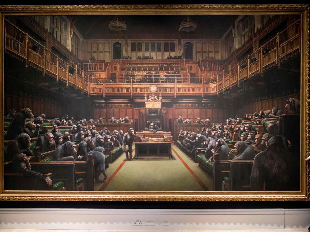 'Devolved parliament' by British artist Banksy sold for £9,879,500 following a 13-minute battle between 10 different bidders. Picture: Tolga Akmen / AFP