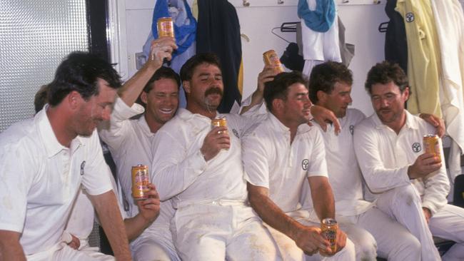 Boon (third from left) enjoys a cold one. (Photo by Adrian Murrell/Getty Images)