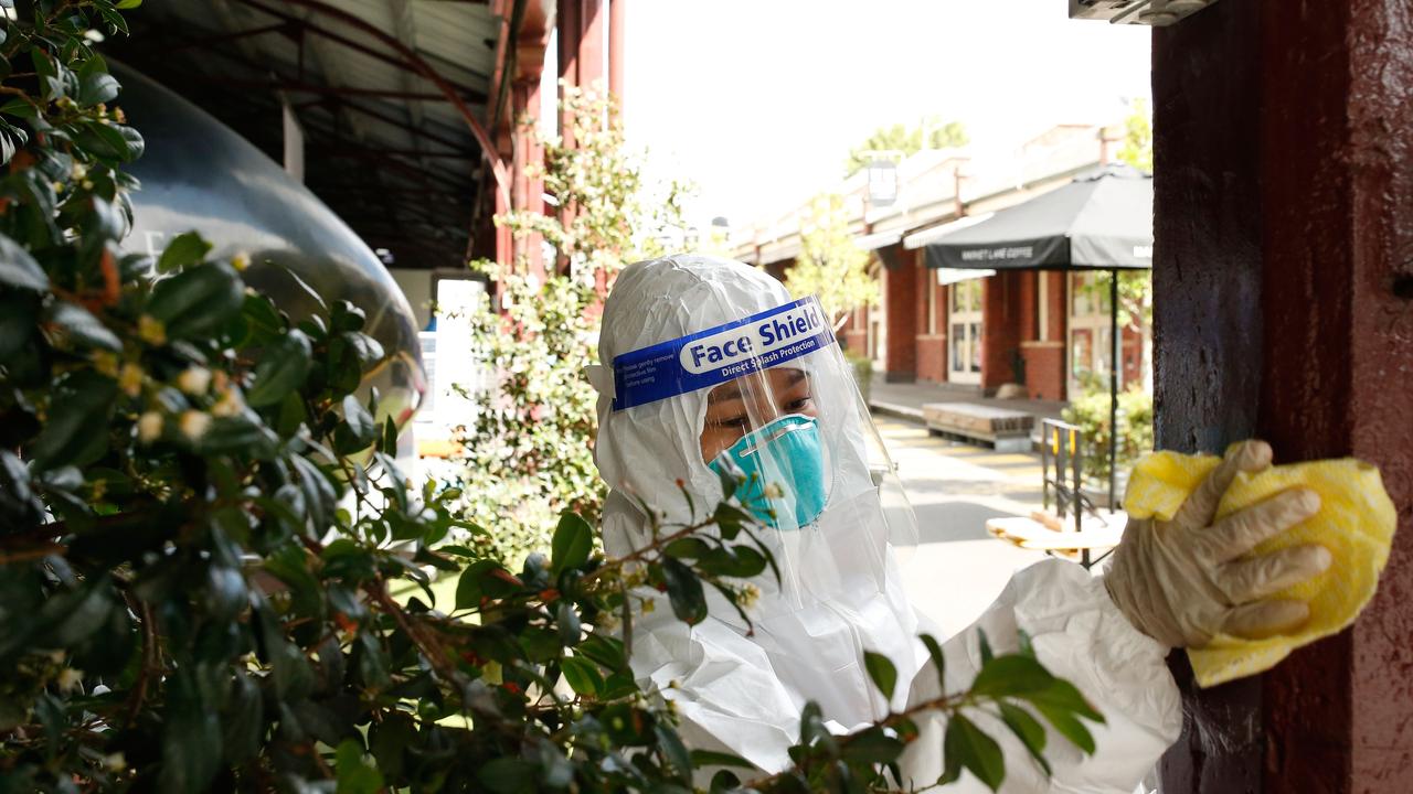 Cleaners perform a deep clean of sections A and B of the Queen Victoria Market. Picture: Darrian Traynor/Getty Images.