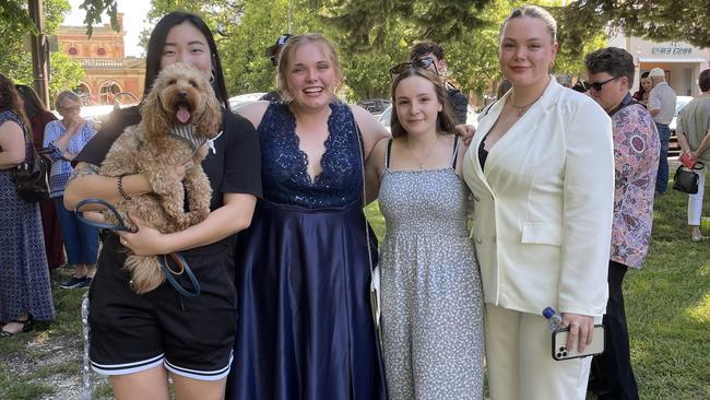 Mel Chen and her dog Ollie, Taylah Creighton, Emily Smith and Madeline Smith ready for a night of fun at formal.