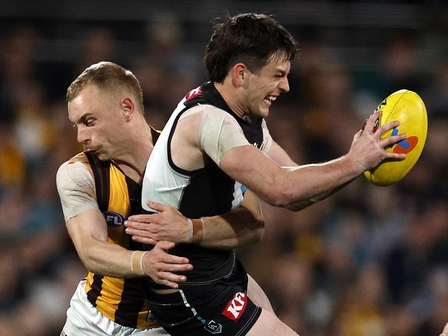 NCA. ADELAIDE, AUSTRALIA. September 13, 2024. AFL Semi Finals. Hawthorn vs Port Adelaide at the Adelaide Oval. Hawthorns James Worpel tackles Ports Zak Butters in the fourth quarter. Picture: Michael Klein