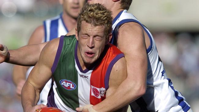 Ryan Murphy of Fremantle takes a big hit.