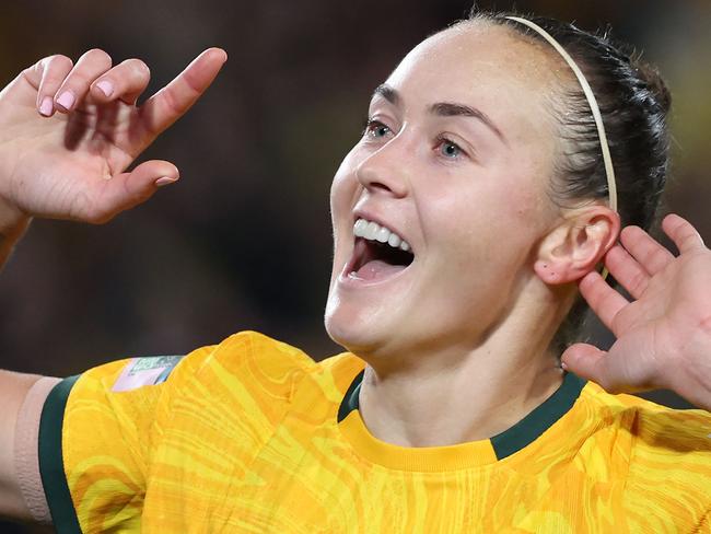 Australia's forward #09 Caitlin Foord celebrates after scoring a goal during the Australia and New Zealand 2023 Women's World Cup round of 16 football match between Australia and Denmark at Stadium Australia in Sydney on August 7, 2023. (Photo by STEVE CHRISTO / AFP)