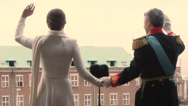 Queen Mary and King Frederik walk out onto the balcony as King and Queen for the first time. Picture: D2/Kongehuset