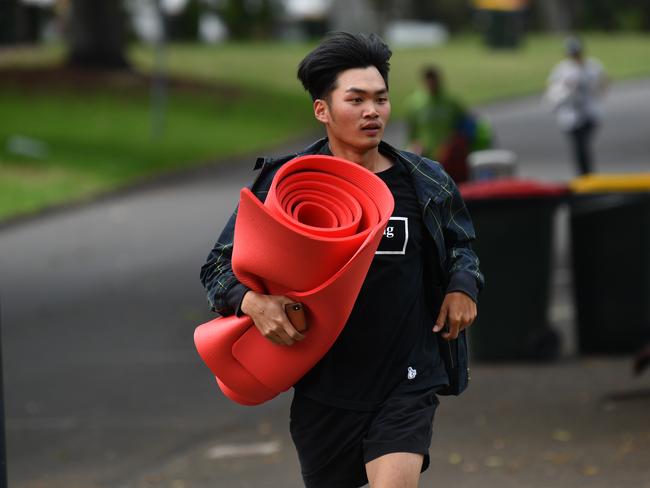 A man is seen running to Mrs Macquarie's Point in preparation for New Years Eve Fireworks in Sydney, Monday, December 31, 2018. Picture: AAP / Brendan Esposito