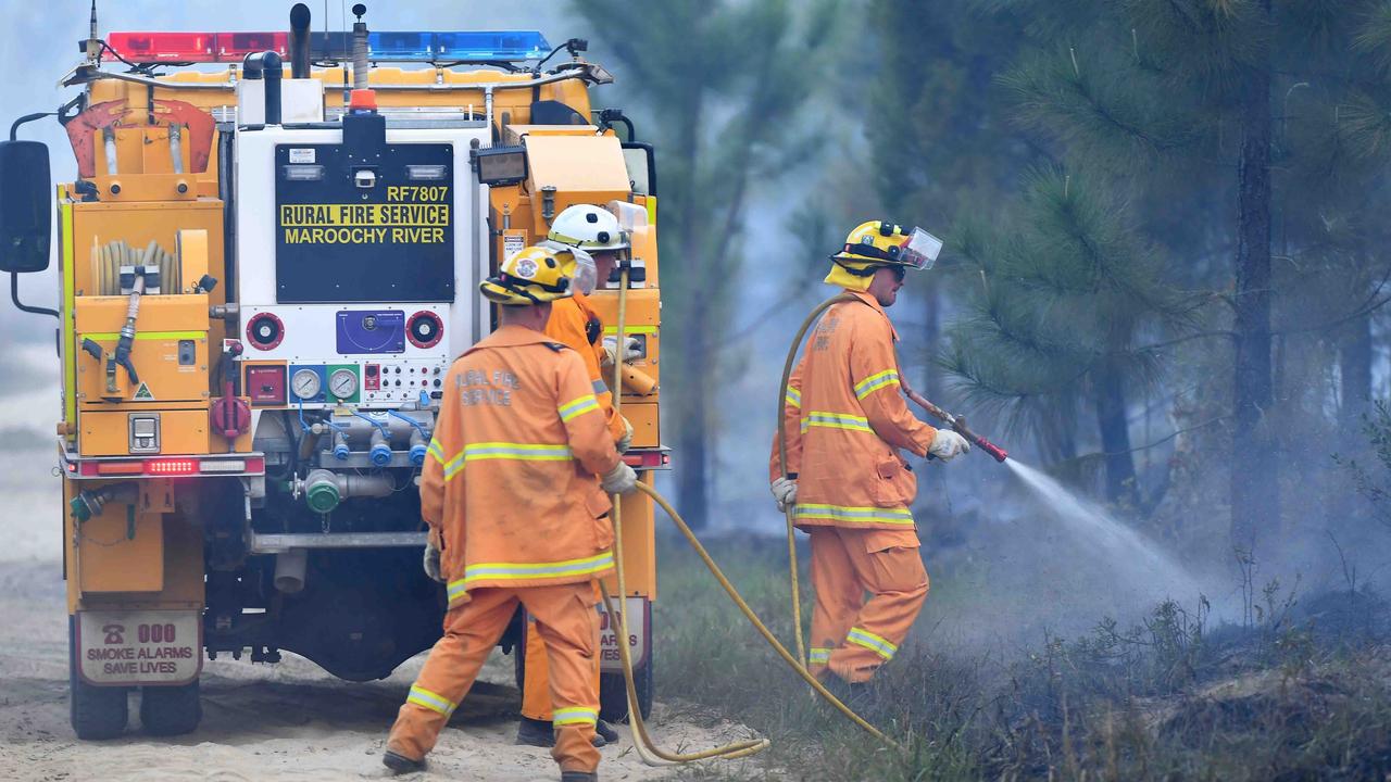 Firefighters monitor the blaze near Beerwah. Picture: Patrick Woods