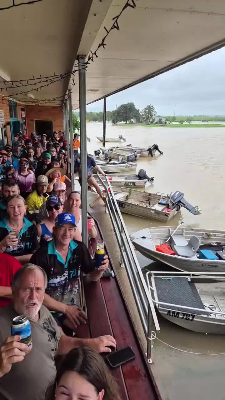 Euramo locals boat to the pub to wait out floods