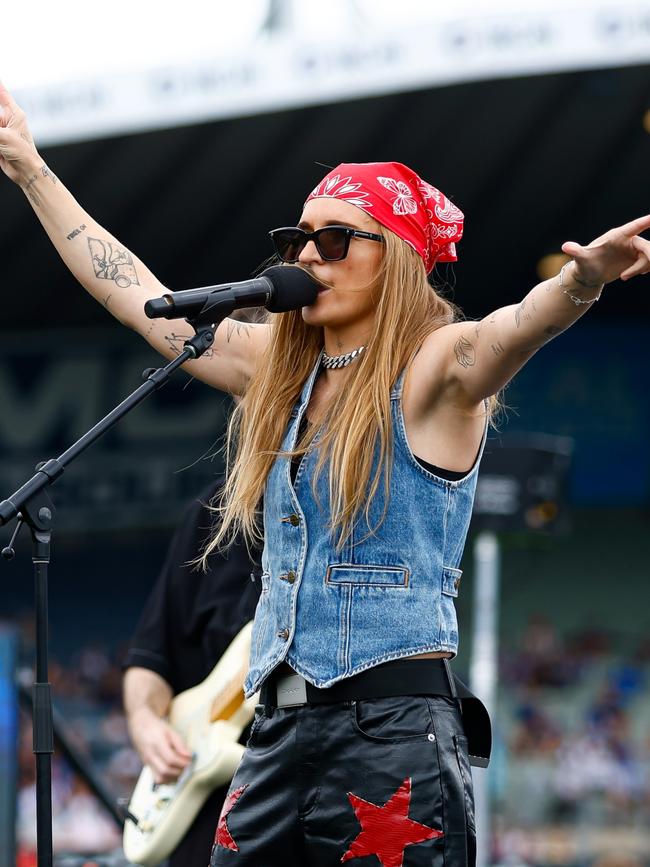 … alongside G Flip, fresh off her performance at the 2023 AFLW Grand Final. Picture: Dylan Burns/AFL Photos via Getty Images