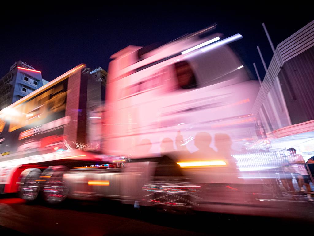 A convoy of trucks arrives in Darwin's CBD to announce the arrival of the Supercars for the round at Hidden Valley Raceway. Picture: Che Chorley