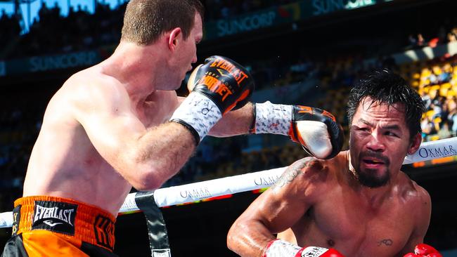 Jeff Horn (left) and Manny Pacquiao (right) during the battle of Brisbane.