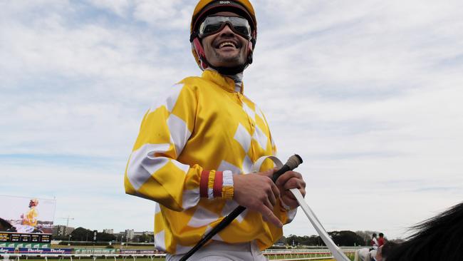 Michael Walker returns to the scale after his victory on Comin' Through.