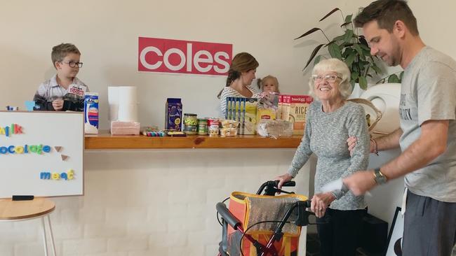 Jason takes his mother “shopping” in the lounge room. Picture: still from the documentary Everybody’s Oma