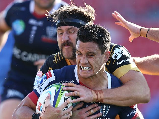 NEWCASTLE, AUSTRALIA - SEPTEMBER 05: Matt Toomua of the Rebels is tackled during the round 10 Super Rugby AU match between the Melbourne Rebels and the Western Force at McDonald Jones Stadium on September 05, 2020 in Newcastle, Australia. (Photo by Jason McCawley/Getty Images)