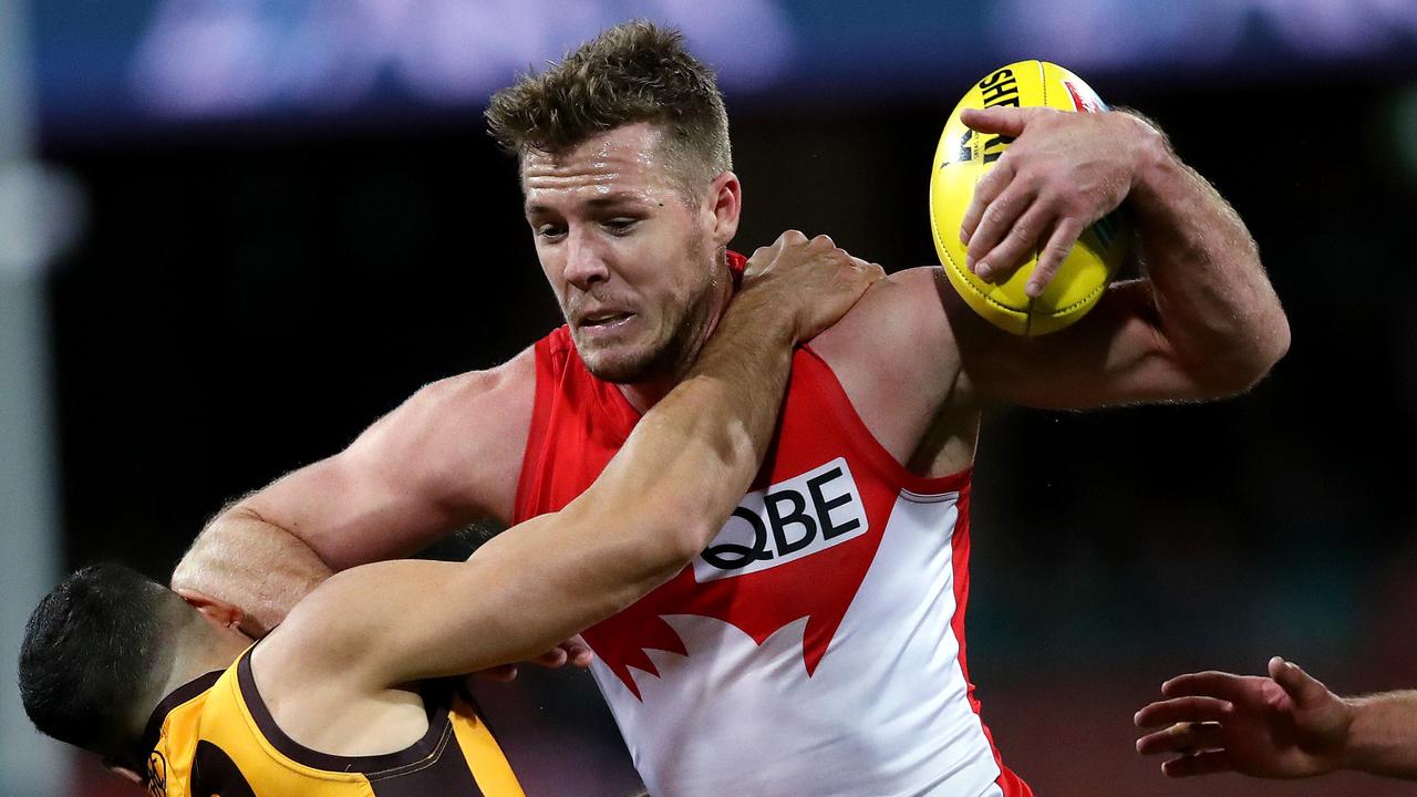 Hawthorn's Paul Puopolo tackles Sydney's Luke Parker during the AFL match Sydney Swans v Hawthorn Hawks at the SCG. Picture. Phil Hillyard