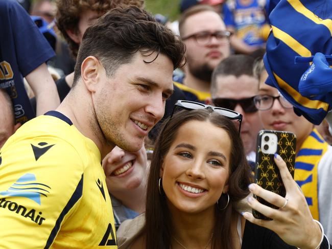 DAILY TELEGRAPH 26TH SEPTEMBER 2022Pictured is Parramatta Eels player Mitchell Moses posing for a photo with a fan who had been watching on at the Parramatta Eels training ground in Kellyville during an open training session ahead of this weekends 2022 NRL Grand Final against the Penrith Panthers.Picture: Richard Dobson