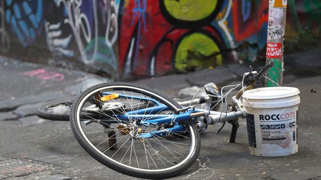 An overturned bike at the Hosier Lane crime scene. Picture: AAP Image/David Crosling