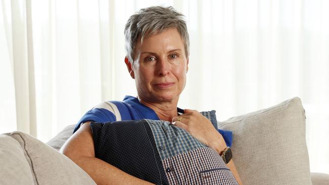 Pauline McGrath embraces a pillow made from her late husbands shirts, her husband died from voluntary assisted dying, West End. Picture: Liam Kidston