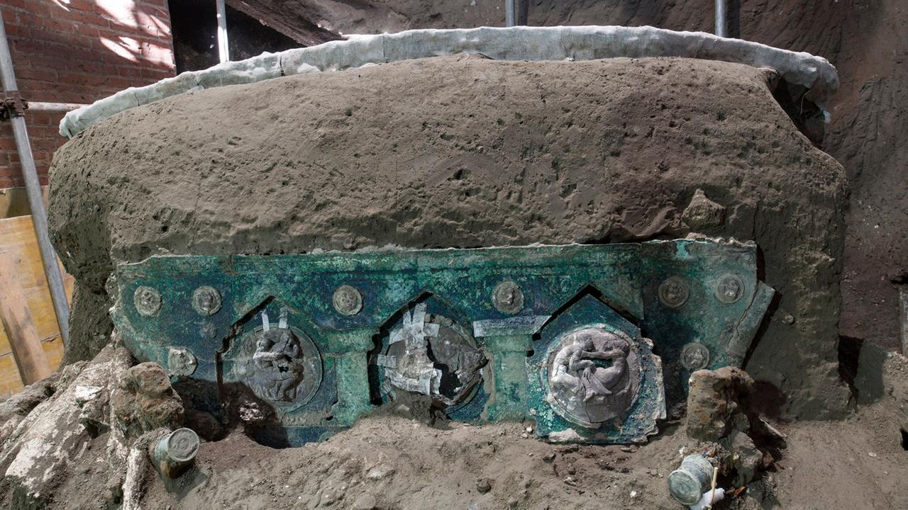 A detail of a large Roman four-wheel ceremonial chariot after it was discovered near Pompeii. Picture: AFP/Pompeii Archaeological Park