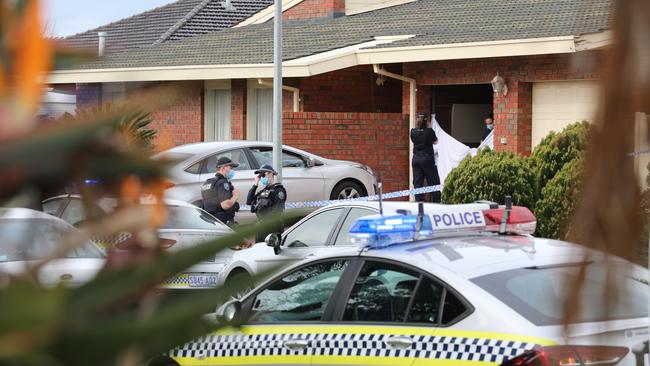 Detectives and police at the scene of the murder-suicide at West Lakes. Picture: Dean Martin