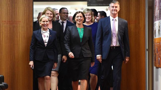 Deb Frecklington (centre), flanked by fellow party members Ros Bates (left) and Tim Mander, arrives at party room meting at Parliament House for the leadership vote. (AAP Image/Dan Peled)