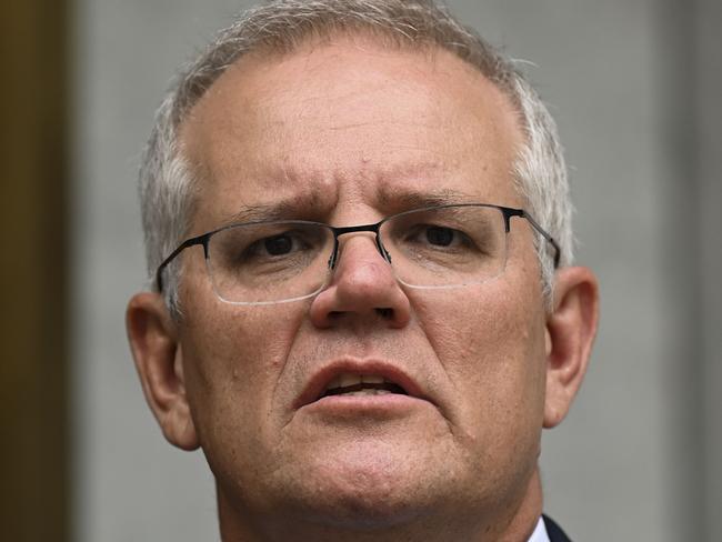 CANBERRA, AUSTRALIA - NewsWire Photos JANUARY 20, 2022: Prime Minister of Australia, Scott Morrison, Chief Medical Officer of Australia, Paul Kelly and Lieutenant-General John Frewen hold a press conference at Parliament House, Canberra. Picture : NCA NewsWire / Martin Ollman