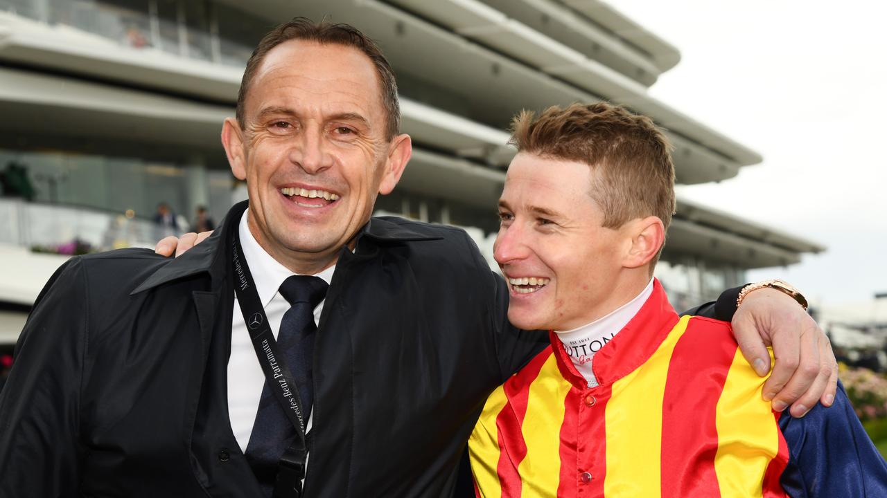 Trainer Chris Waller with Nature Strip’s jockey James McDonald. Picture: AAP/Vince Caligiuri