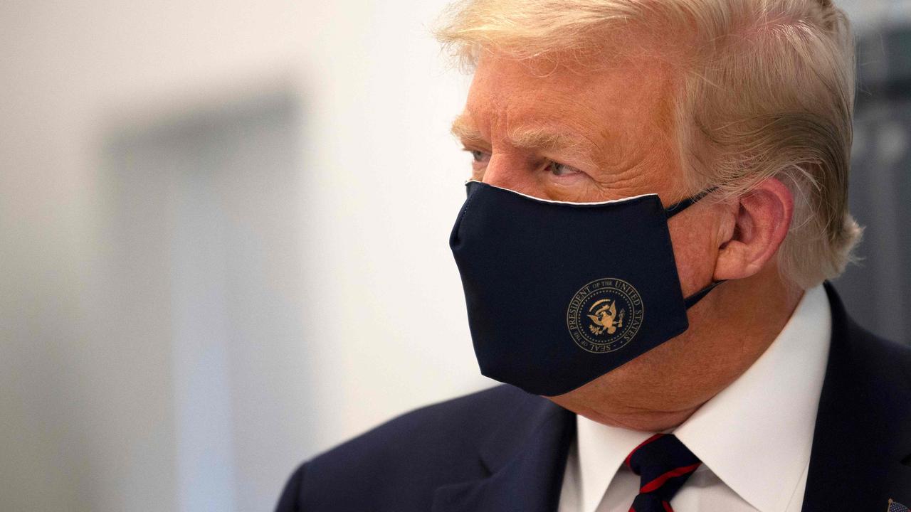 Donald Trump wearing a mask at the Bioprocess Innovation Centre at Fufifilm Diosynth Biotechnologies. Picture: Jim Watson/AFP