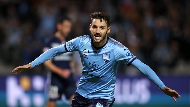 Milos Ninkovic celebrates scoring a goal against Melbourne Victory.