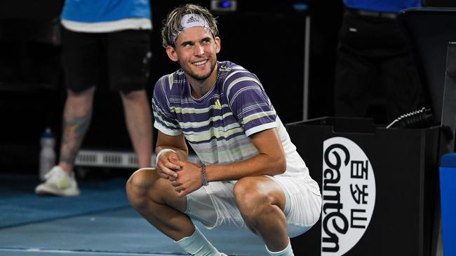 Austria’s Dominic Thiem is all smiles as Neil Diamond’s Sweet Caroline plays during a break in play. Picture: AFP