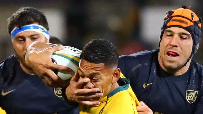 Israel Folau of the Wallabies cops a facial in last year’s Test against Argentina.