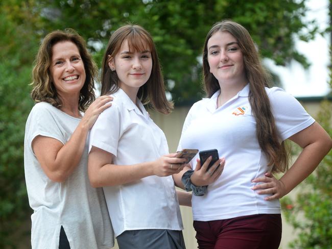 (LtoR) Kylie Gilhooly with her daughters Abrianna 15years  and Isabelle 14years old as several western Sydney schools have signed on to buy pouches which lock kids phones during school hours, stopping them from using them in class. Picture: Jeremy Piper