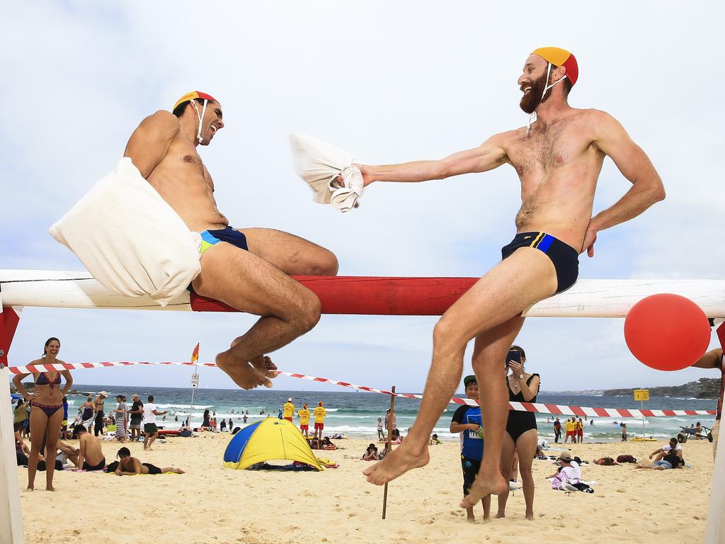 Dan and Carlos compete in an Australia Day pillow fight on Bondi Beach. North Bondi’s John Glover was crowned theNational Pillow Fight Champion in 1954. In commemoration of John Glover, North Bondi SLSC, est 1906, is bringing back this tradition on Australia Day in 2017, where members from clubs across Sydney will compete against each other to see who is the last man, or woman, standing. Picture: Dylan Robinson