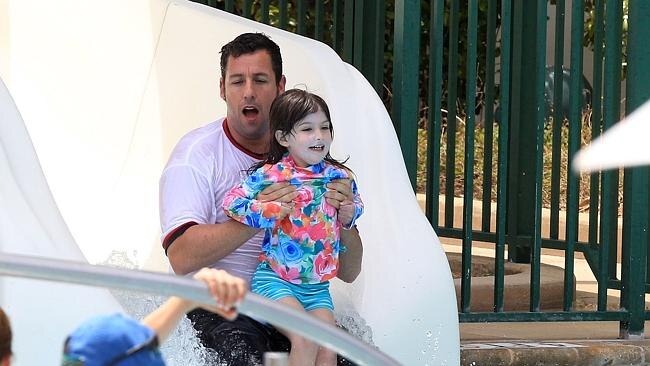 Talk about a big kid! Adam Sandler seems to be having more fun than his daughter. Picture: Splash News