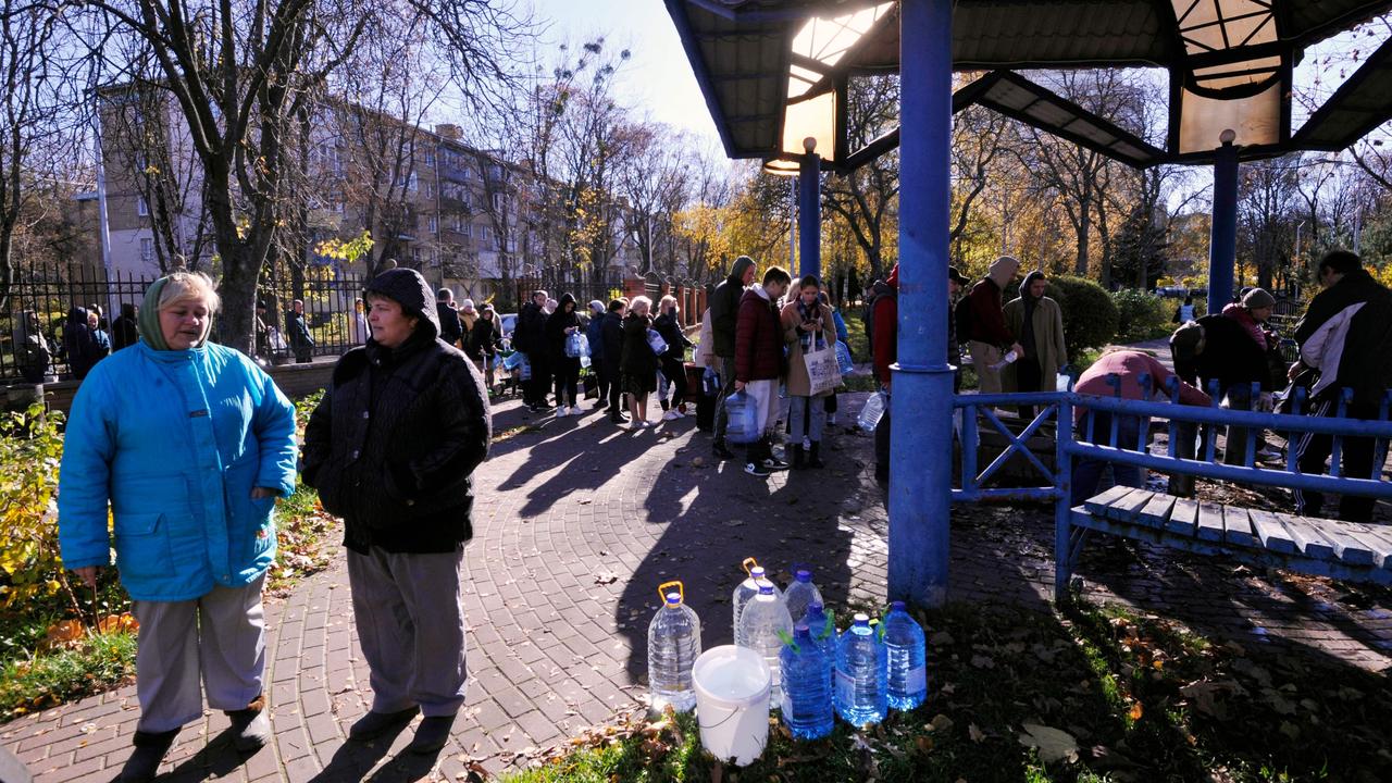 Kyiv residents queue to collect water in plastic containers and bottles at one of the parks in the Ukrainian capital Kyiv. Picture: AFP