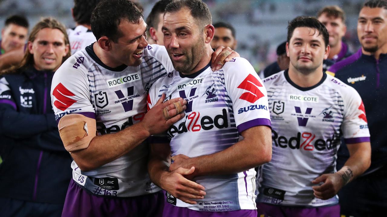 Cameron Smith holds his ribs post Grand Final.