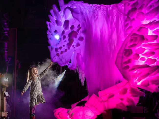 Yula Durst, 5, with The Guardian, the biggest-ever puppet created for White Night. Picture: Jason Edwards