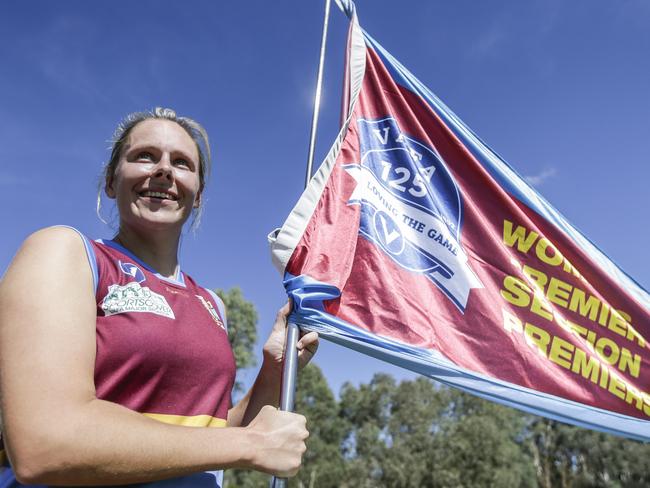 VAFA (Women): Marcellin v Kew. Kew coach addressing players. Marcellin captain Al Rock with the premiership flag. Picture: Valeriu Campan