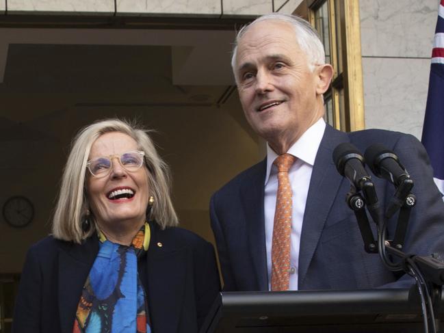 Outgoing Australian Prime Minister Malcolm Turnbull holds a final press conference with his wife Lucy Turnbull, second from right, and his daughter Daisy Turnbull-Brown, third from right, and his grandchildren Jack Turnbull-Brown and Alice Turnbull-Brown before leaving Parliament in Canberra, Friday, Aug. 24, 2018. Australia government lawmakers on Friday elected Treasurer Scott Morrison as the next prime minister in a ballot that continues an era of extraordinary political instability. (AP Photo/Andrew Taylor)